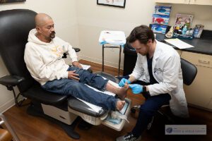 Dr. Hendricks in the office with patient